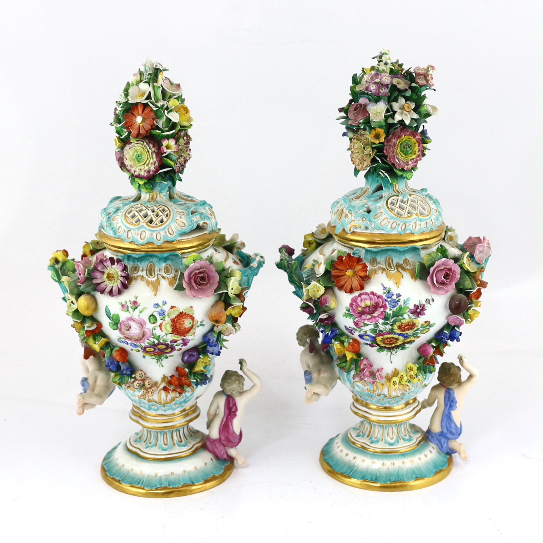 A pair of Meissen topographical flower encrusted vases and covers, 19th century, losses